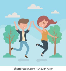 happy couple celebrating jumping in the forest scene
