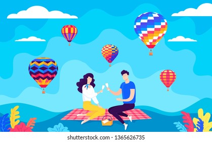 Happy couple having romantic picnic and beautiful color balloons view