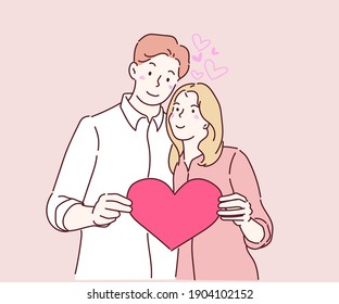Happy couple in love holding red paper heart. In love couple concept. Hand drawn in thin line style, vector illustrations. 