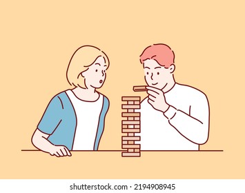 Happy couple playing game of wooden towers. Hand drawn style vector design illustrations.