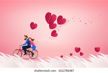 Happy couple is riding a bicycle together  and holding red balloons on pink  background.  Illustration of Love and Valentine Day. Paper cut style.