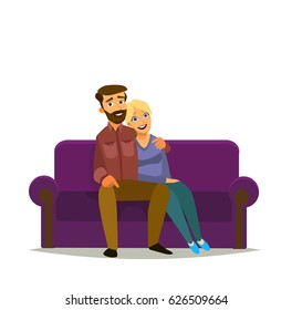 Happy couple sitting on sofa in home interior. Way of life, the concept of family and togetherness. Portrait of a young family.