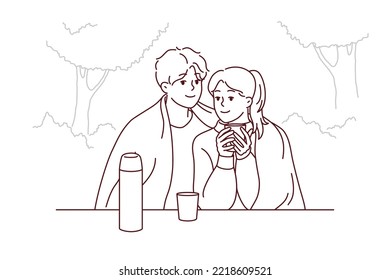 Happy couple sitting in park hugging drinking warm coffee enjoy romantic date together. Smiling loving man and woman embrace cuddling outdoors. Vector illustration.