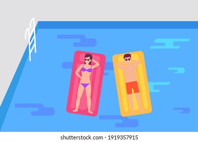 Happy couple sunbathing together while lying on the floating buoy at the swimming pool