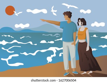 happy couple walking along a beach