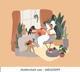 Happy cute girl with towel on head and in bathrobe, having breakfast in morning after bathing, read the newspaper and resting with cat. Feminine Daily life by young woman in interior with homeplant