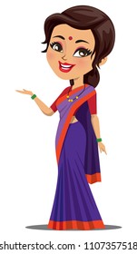 A happy and cute Indian woman wearing a traditional saree and showing something