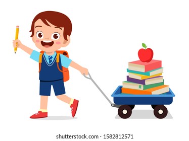 happy cute kid boy bring book to school