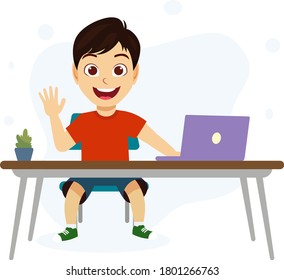 Happy cute kid boy in a desk with laptop saying hi