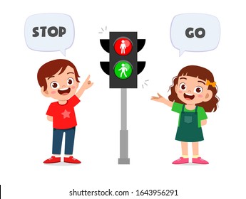 happy cute kid boy and girl with traffic sign