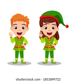 Happy cute kid boy and girl waving and celebrating merry charismas