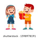 happy cute kid boy give present to friend