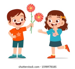 happy cute kid boy give flower to friend