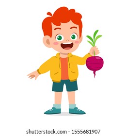 happy cute kid boy holding fresh vegetable