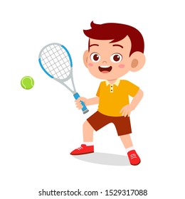 happy cute kid boy play tennis