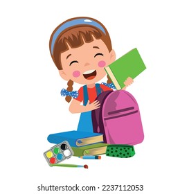 happy cute kid boy prepare bag for school