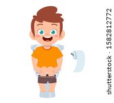 happy cute kid boy sit on the toilet