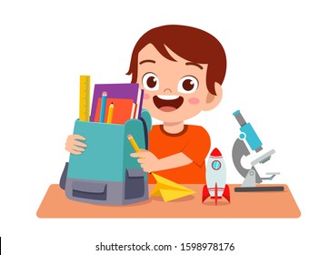 happy cute kid boy study on cute table