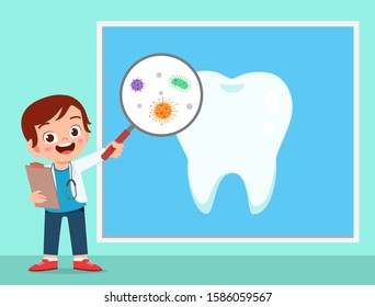 happy cute kid boy using dentist uniform