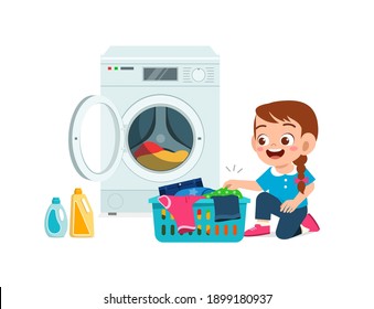 happy cute kid do laundry with washing machine