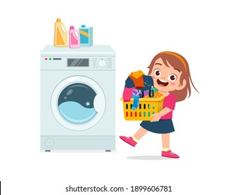 happy cute kid do laundry with washing machine