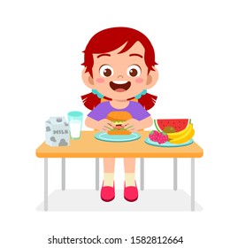 happy cute kid girl eat healthy food