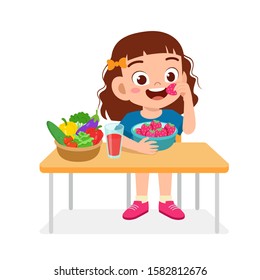 happy cute kid girl eat healthy food