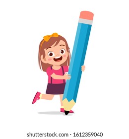 happy cute kid girl holding big pencil