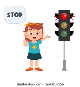 happy cute kid girl with traffic sign