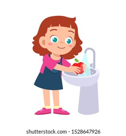 happy cute kid girl wash vegetable fruit clean