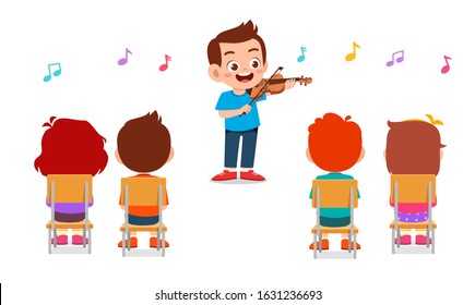 happy cute little boy play violin in class