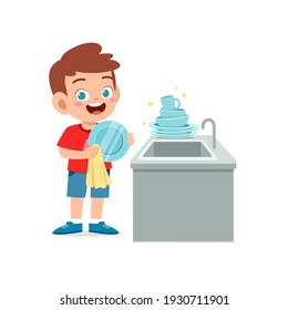 happy cute little boy washing dish in the kitchen