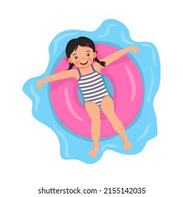 happy cute little girl with swimsuit lying on inflatable rubber ring having fun floating in swimming pool on summer time