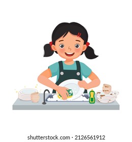 happy cute little girl washing dishes standing at sink in the kitchen doing housework chores at home