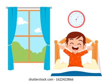 happy cute little kid boy wake up in the morning