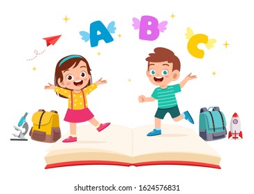 happy cute little kid boy and girl with book and letters