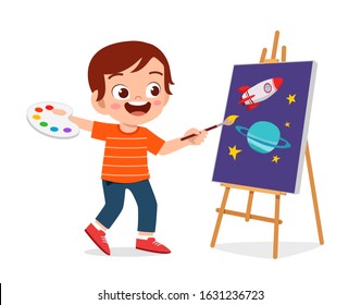 happy cute little kid boy draw on canvas