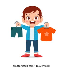 happy cute little kid boy choose clothes