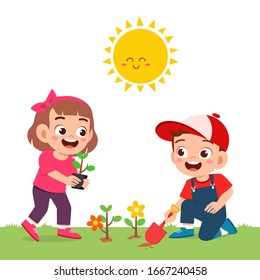 happy cute little kid boy and girl plant flower