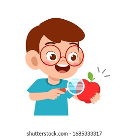 happy cute little kid boy holding magnifying glass