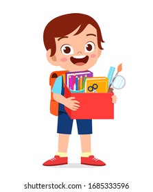 happy cute little kid boy carry box of school supplies