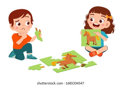 Happy Cute Little Kid Boy And Girl Play Jigsaw Puzzle