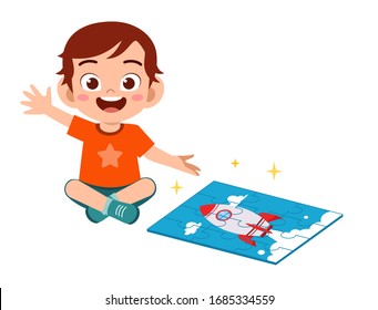 happy cute little kid boy play jigsaw puzzle