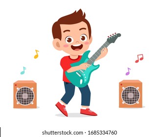 happy cute little kid boy play guitar