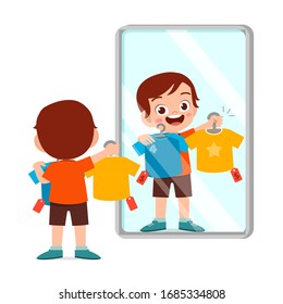 happy cute little kid boy choose a clothes