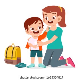 happy cute little kid boy prepare go to school with mom