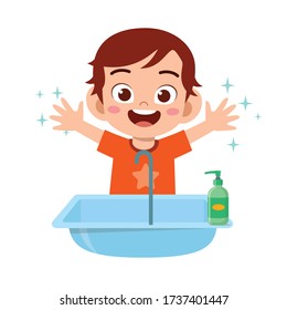 happy cute little kid boy wash hand in sink