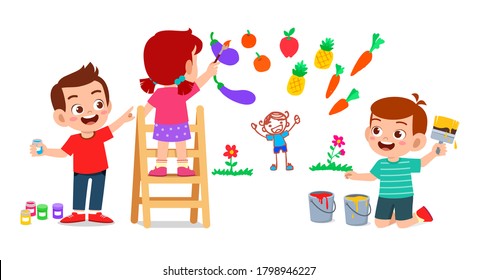 happy cute little kid boy and girl draw with paint on wall together