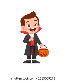 Happy Cute Little Kid Boy And Girl Celebrate Halloween Wears Dracula Vampire Costume With Cape