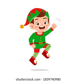 happy cute little kid boy and girl wearing green elf christmas costume